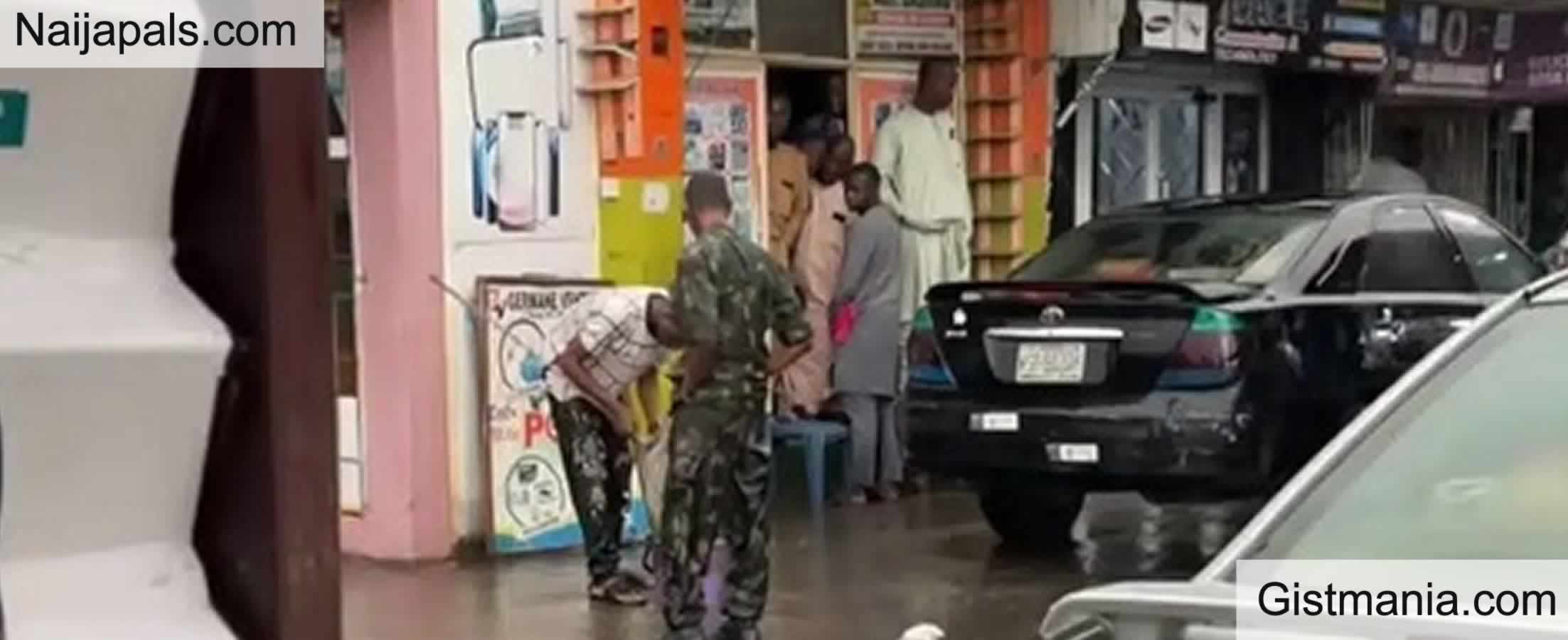 Moment Soldier Forces Man To Mop Shopping Mall in Heavy Rain For Wearing Military Camouflage